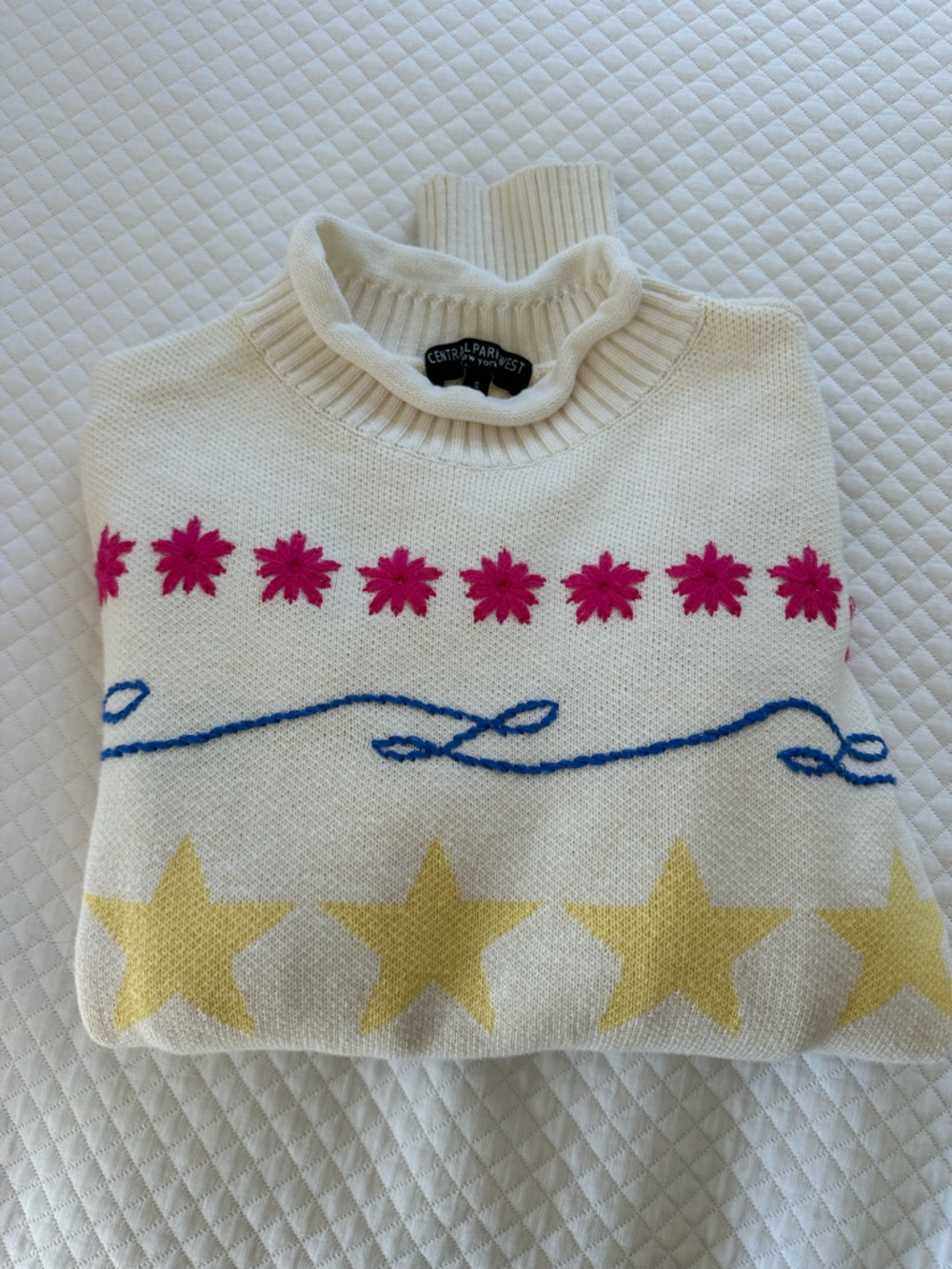 Central Park West Cream Sweater with Yellow Stars, Blue & Pink Design
